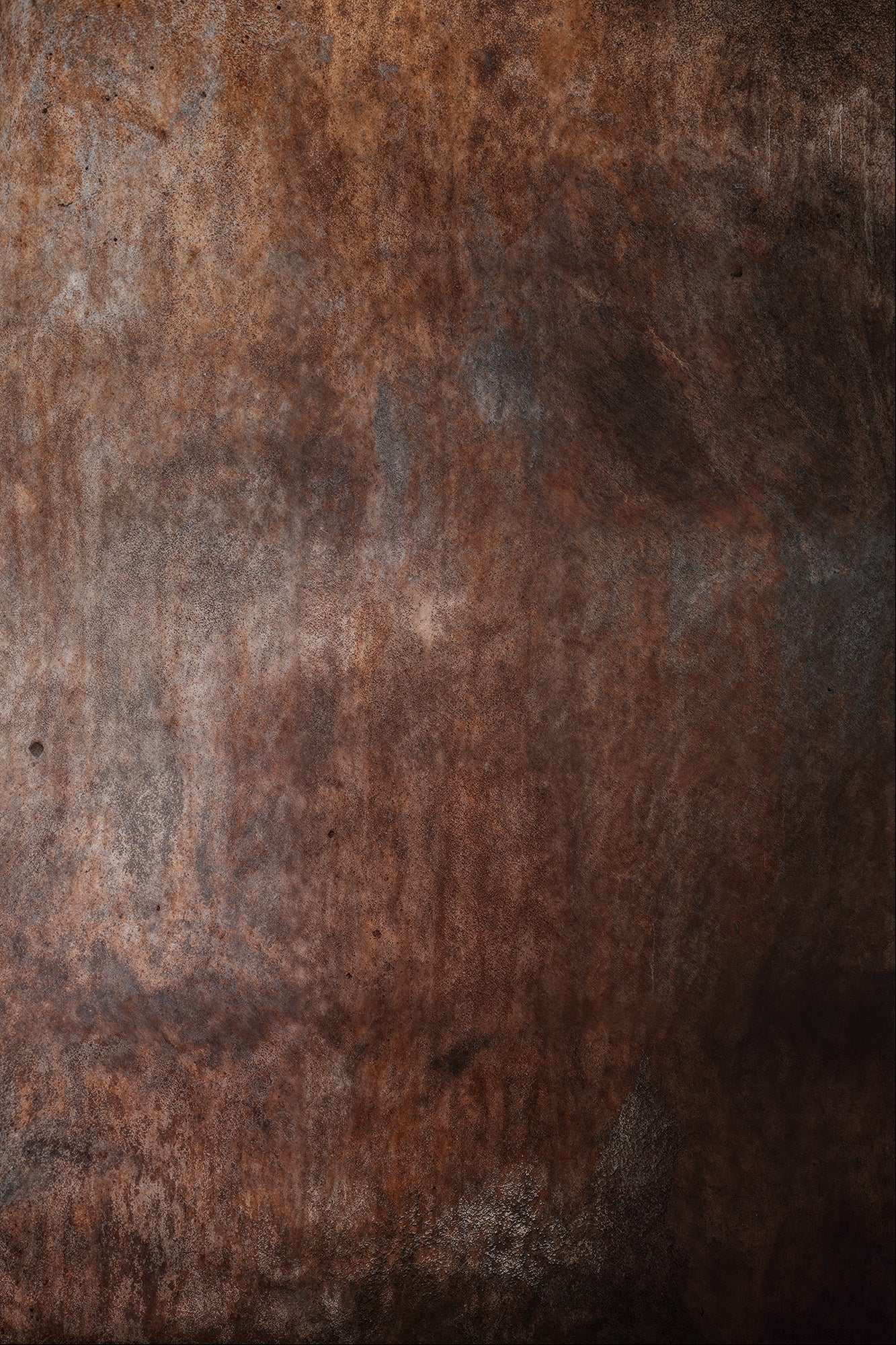 Rustic, textured old boiler backdrop with dark, rust tones for industrial photography.