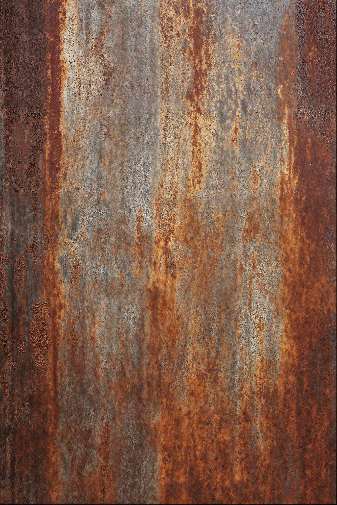 Rusted iron surface with rich rust tones, showcasing natural oxidation and industrial texture.