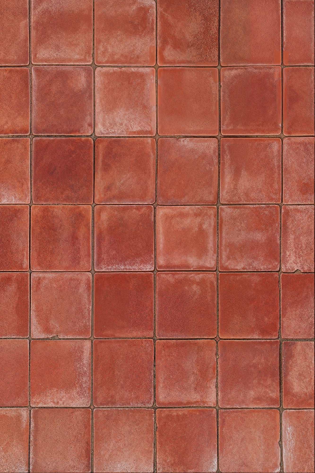 Aged Terracotta backdrop with rich red hue and textured finish.