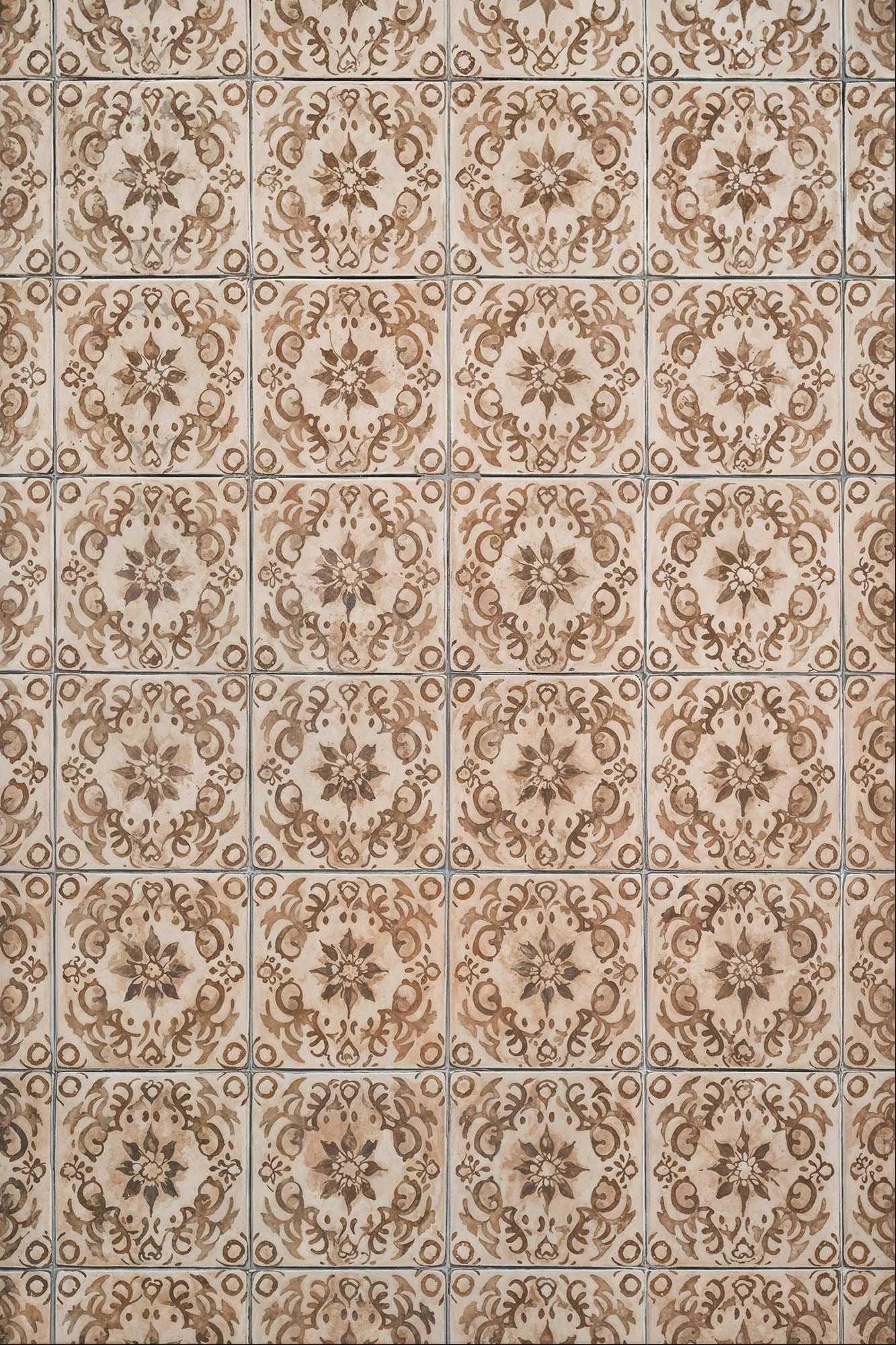 Timeless Tiles with intricate antique floral patterns and aged tones.