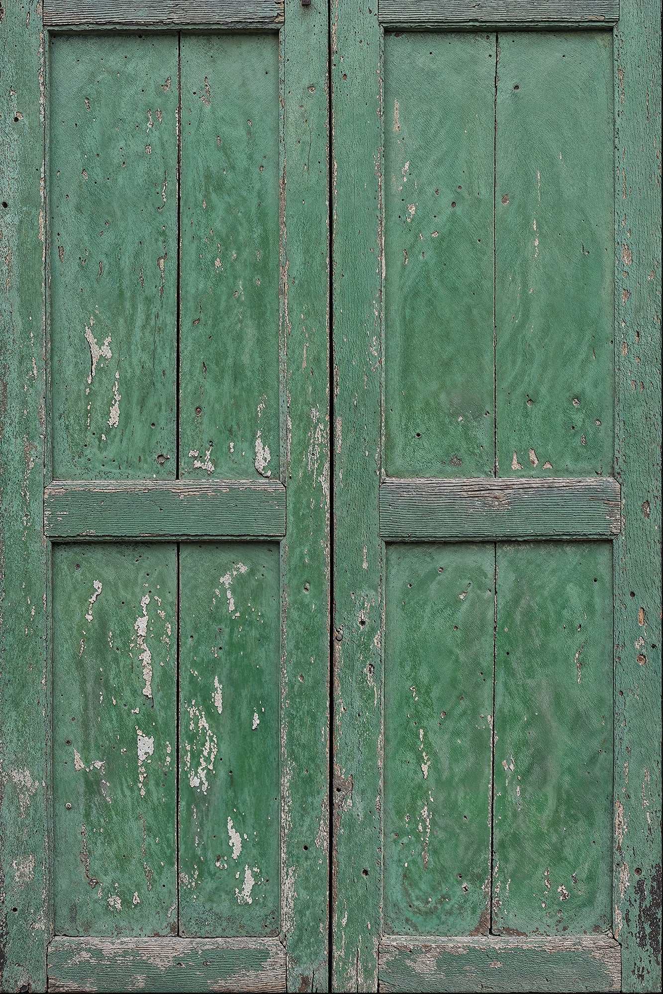 Worn green door backdrop with distressed paint texture for rustic photography.