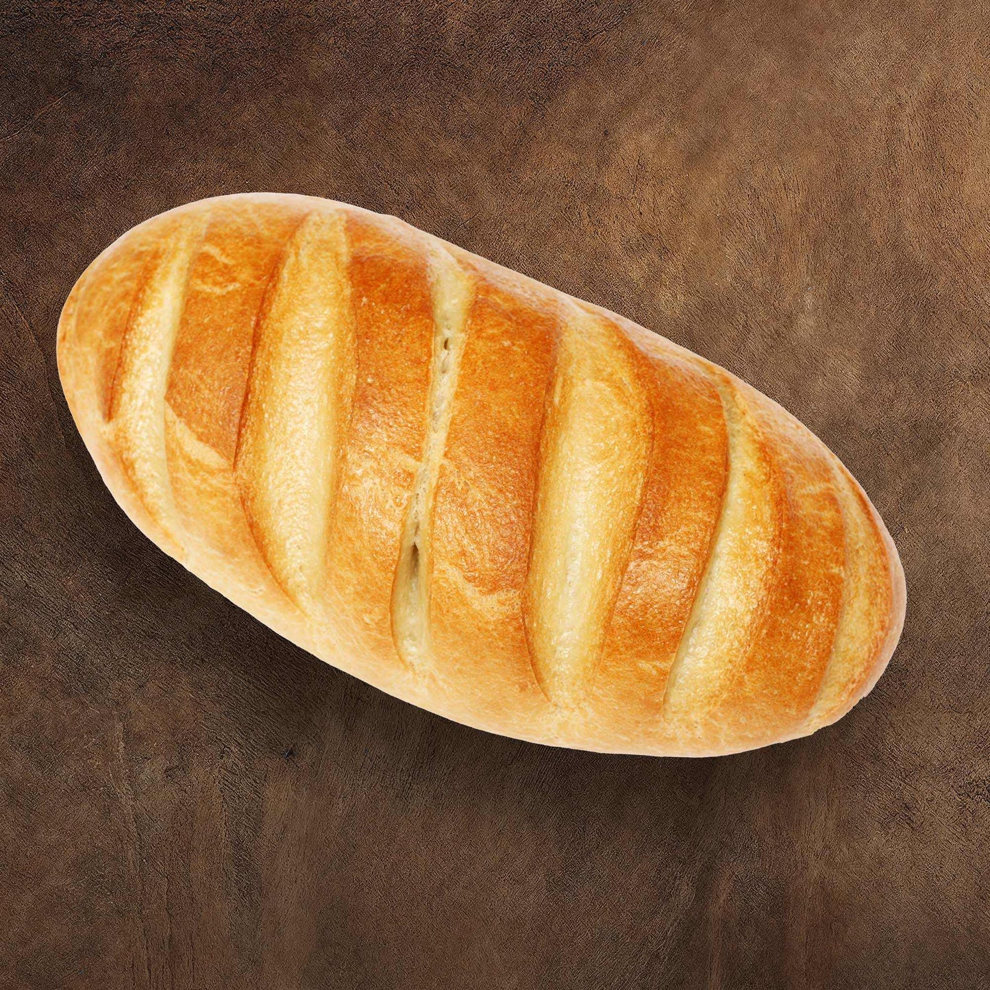 Warm brown textured "Caffè Mocha" backdrop with artisanal bread displayed.