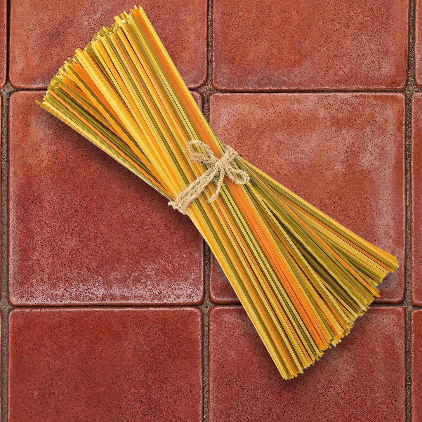 Aged terracotta backdrop with warm, textured red hue and weathered finish.