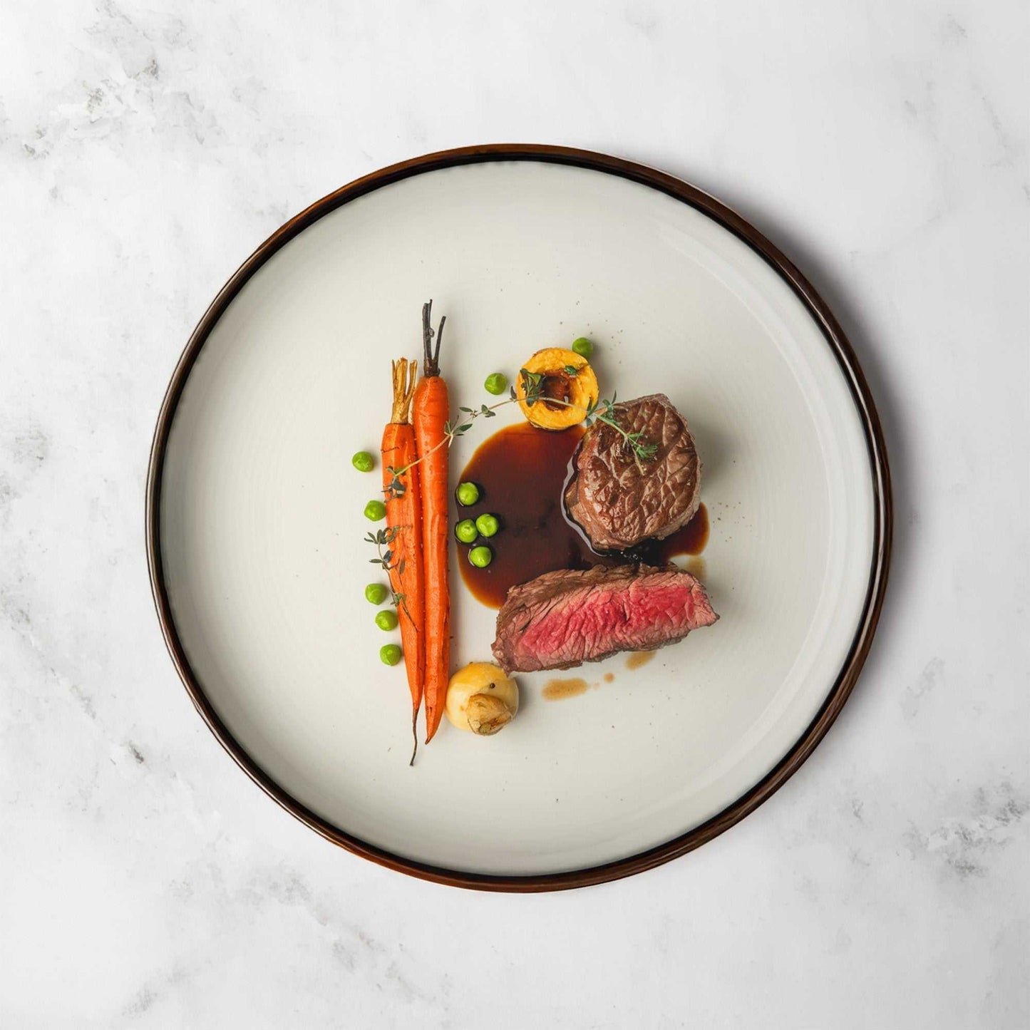 White Silk Marble backdrop with subtle grey veining, showcasing gourmet food on a plate.